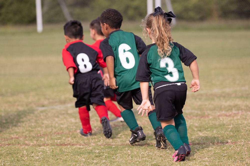 Youth Soccer in Tullahoma on the sports field. Young children in uniform kicking around a soccer ball