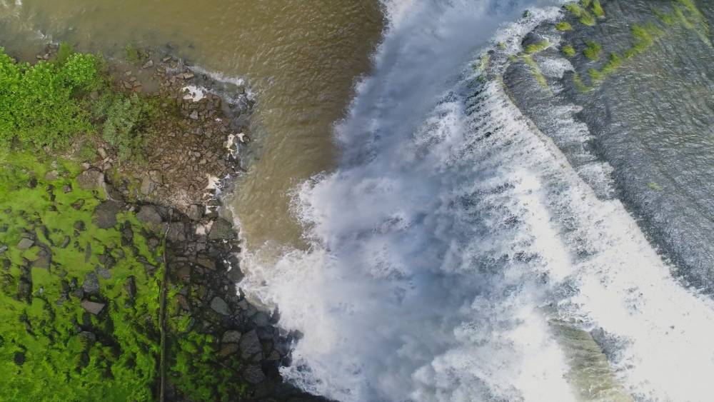 Burgess Falls in Tennessee after a heavy storm. Beautiful rushing waters dropping 70 feet down as seen from a drone