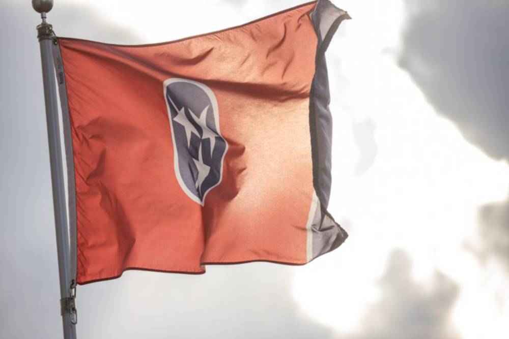 Tennessee State Flag backlight by the sun and waving in the breeze